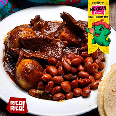 Authentic Mexican dish with rich chili sauce, beans, and potatoes prepared using Rico Rico Mexican chili spices